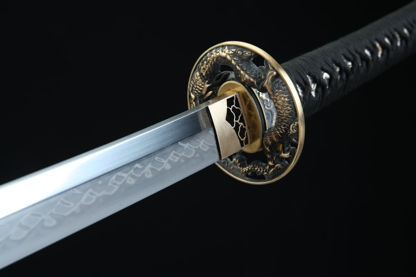Aged bronze tsuba guard of Jaryū katana featuring traditional Japanese metalwork and patina finish