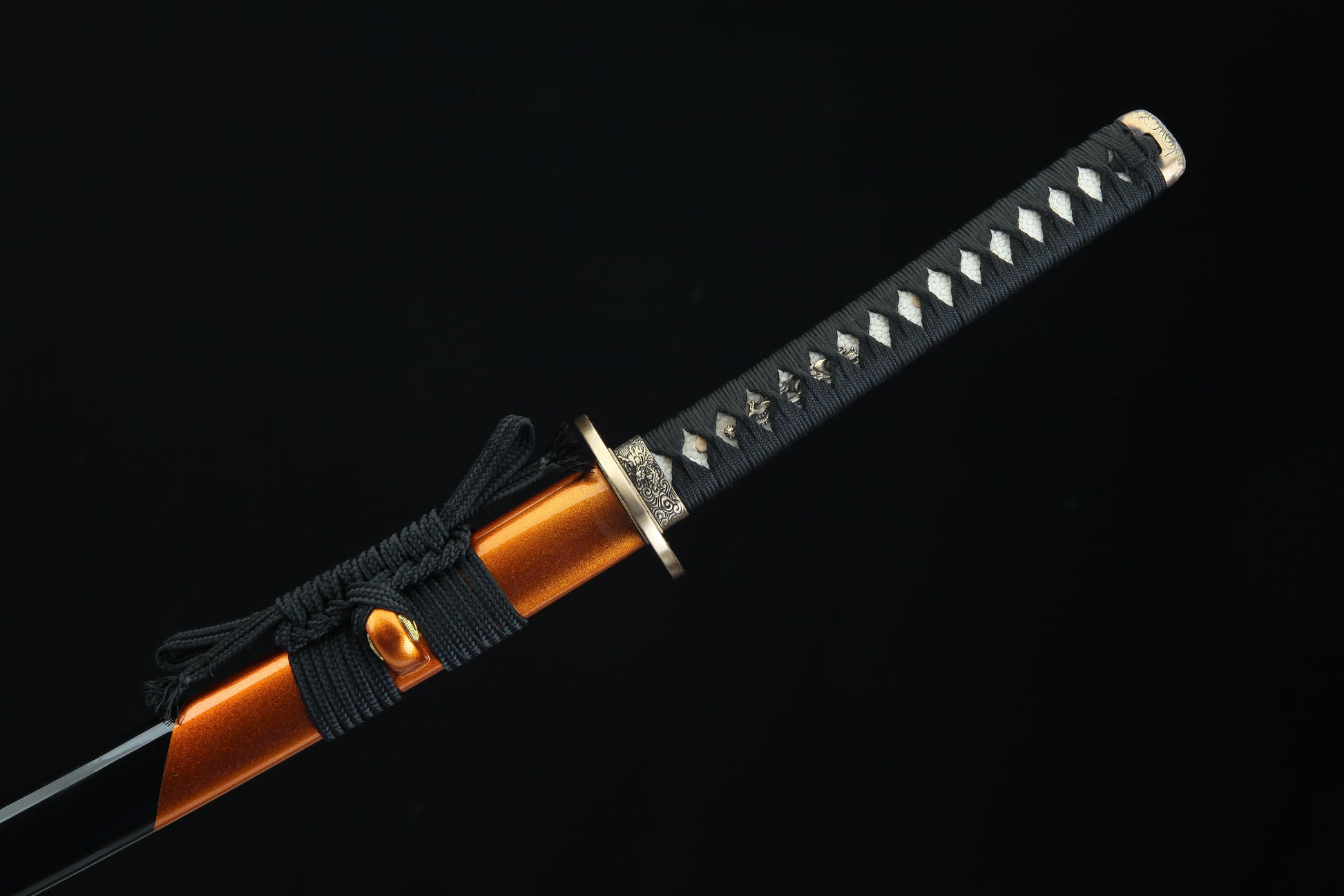 Black cord-wrapped tsuka handle of Fūrai katana with authentic fish skin samegawa and bronze menuki fittings