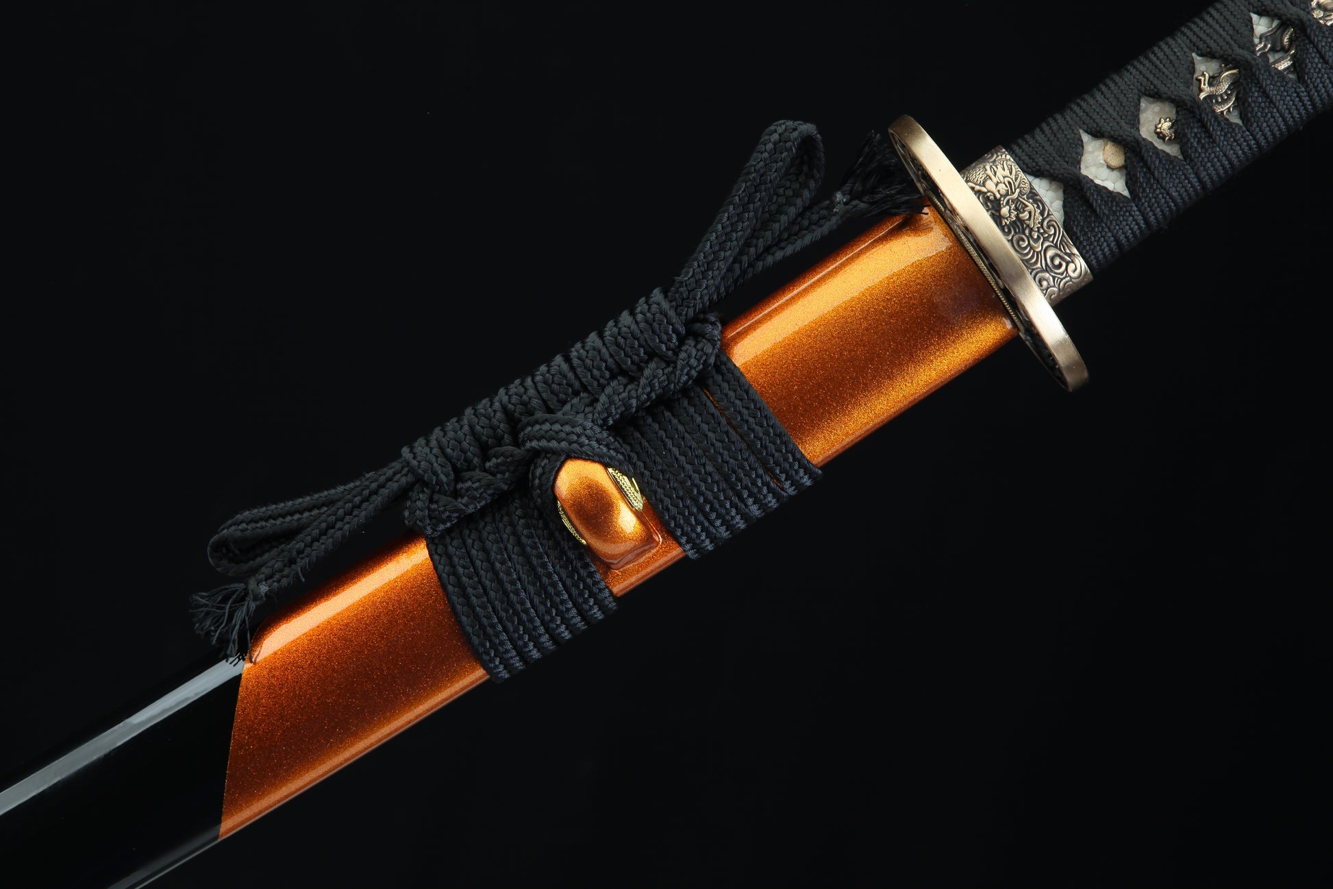 Black cord-wrapped tsuka handle of Fūrai katana with authentic fish skin samegawa and bronze menuki fittings