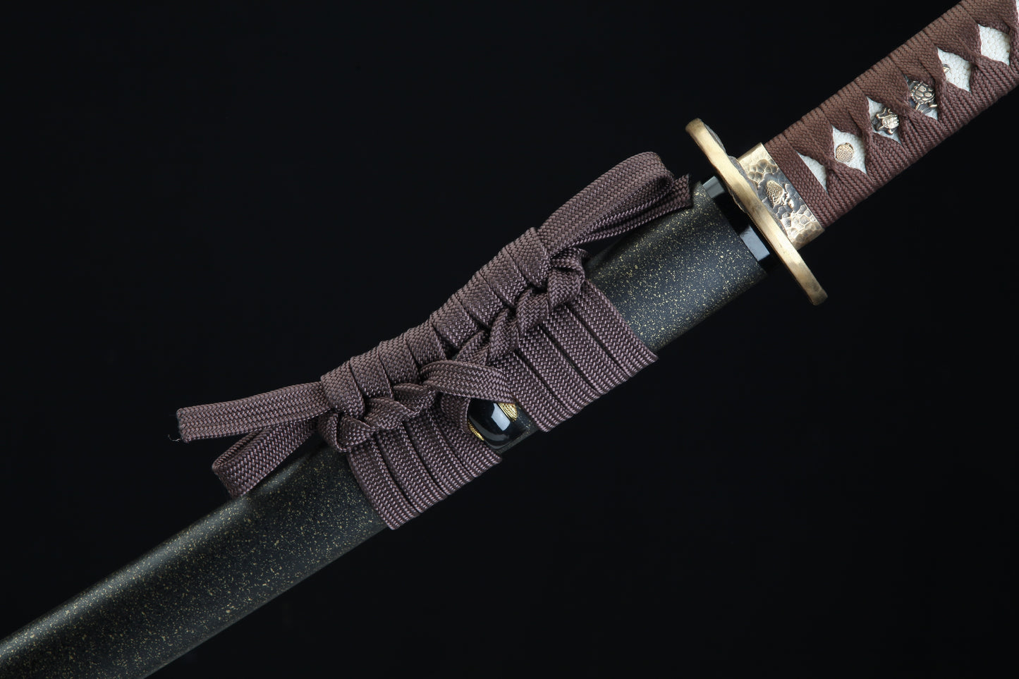 Sword with a brown leather sheath on a black background