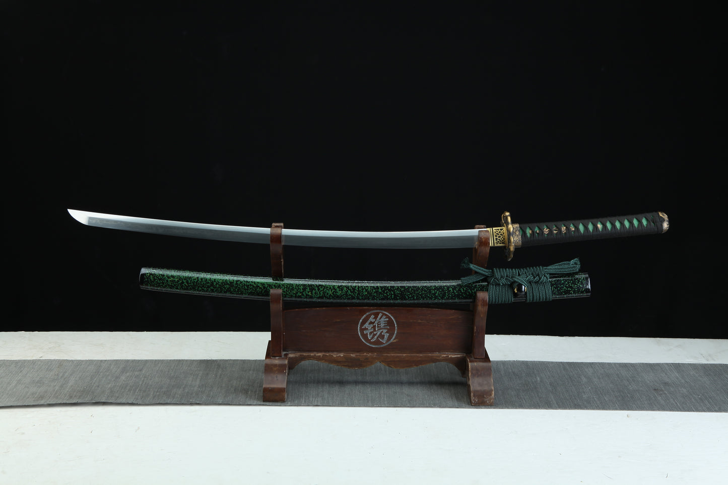 Sword on a wooden stand with a black background