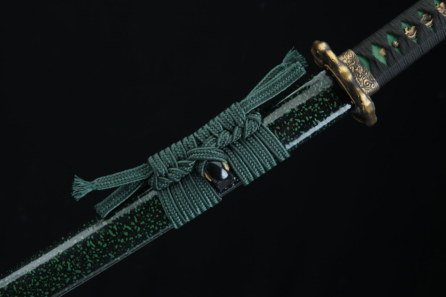 Green braided belt with a decorative buckle on a black background