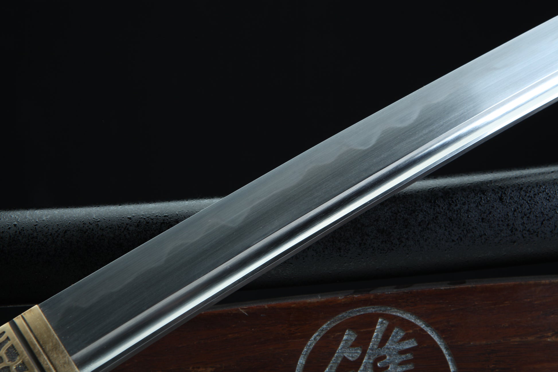 Sword blade with a dark background