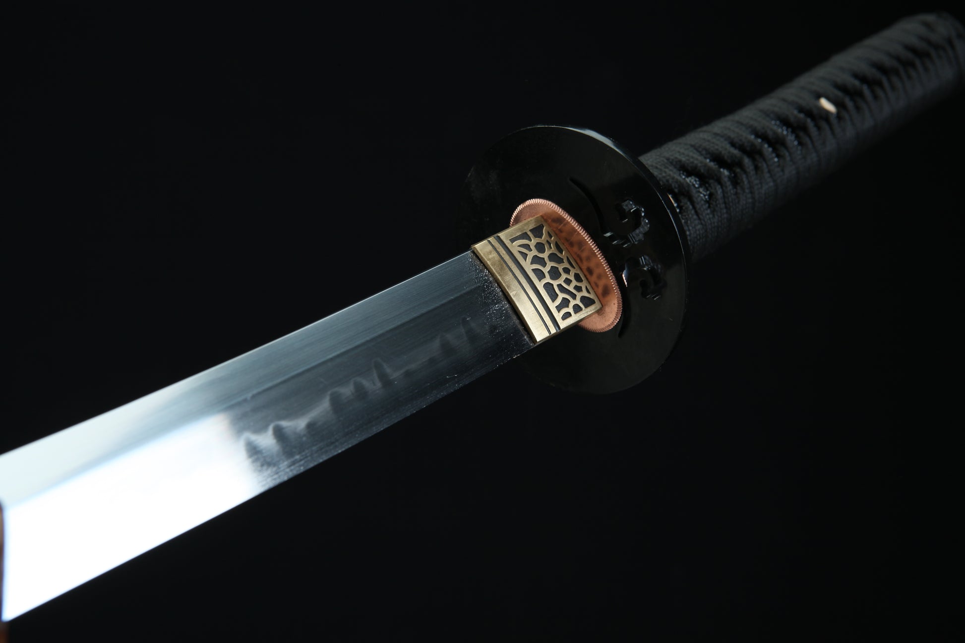 Sword with a black sheath on a dark background
