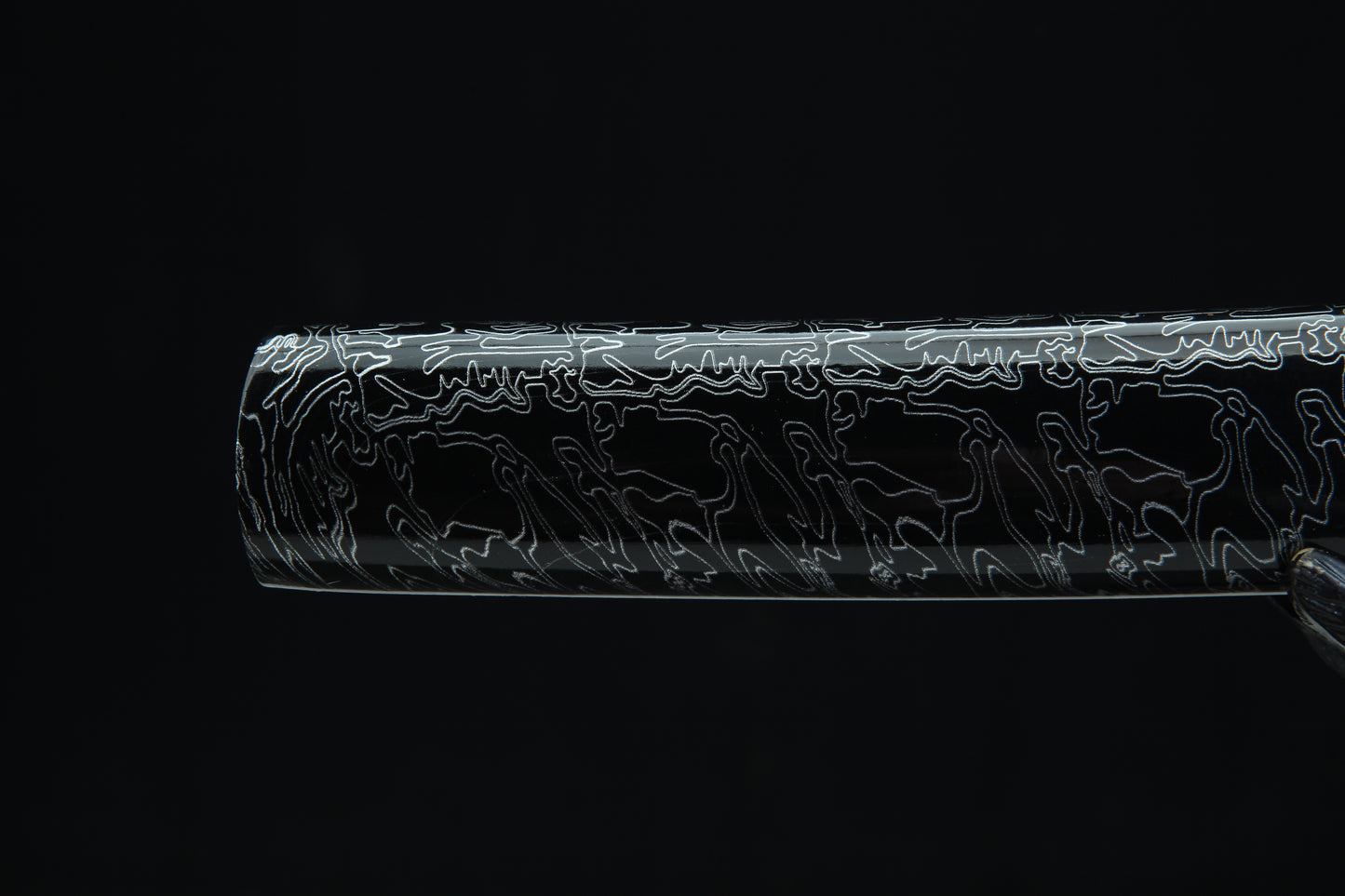 Black lacquered wooden saya with white pattern design of Tengyaku tanto featuring black cord wrapping and traditional finish