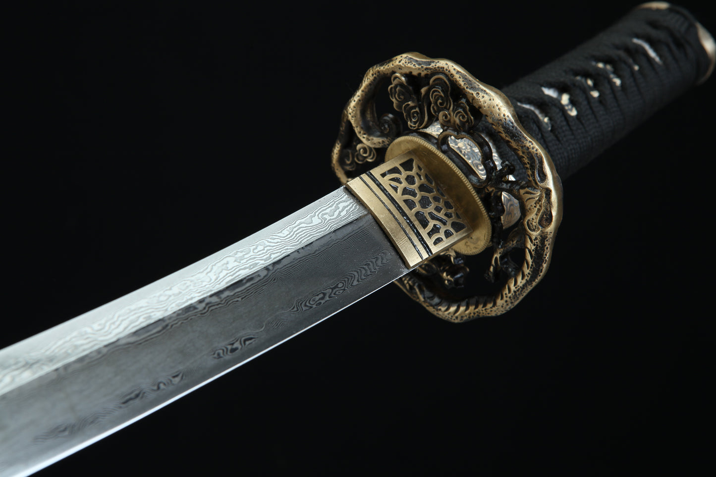 Aged bronze tsuba guard of Tengyaku tanto featuring traditional Japanese metalwork with authentic patina finish