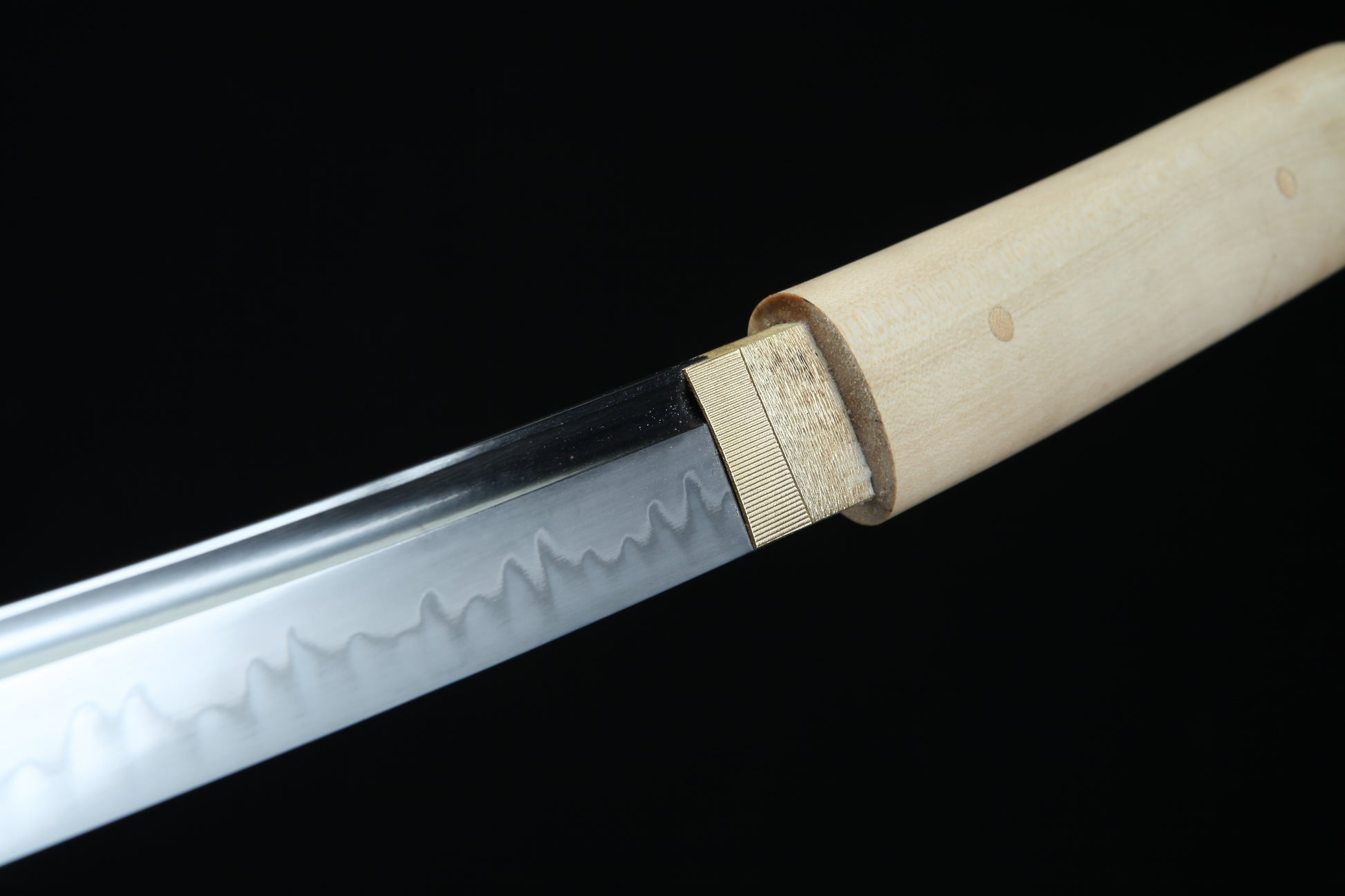 Sword with a wooden handle on a black background
