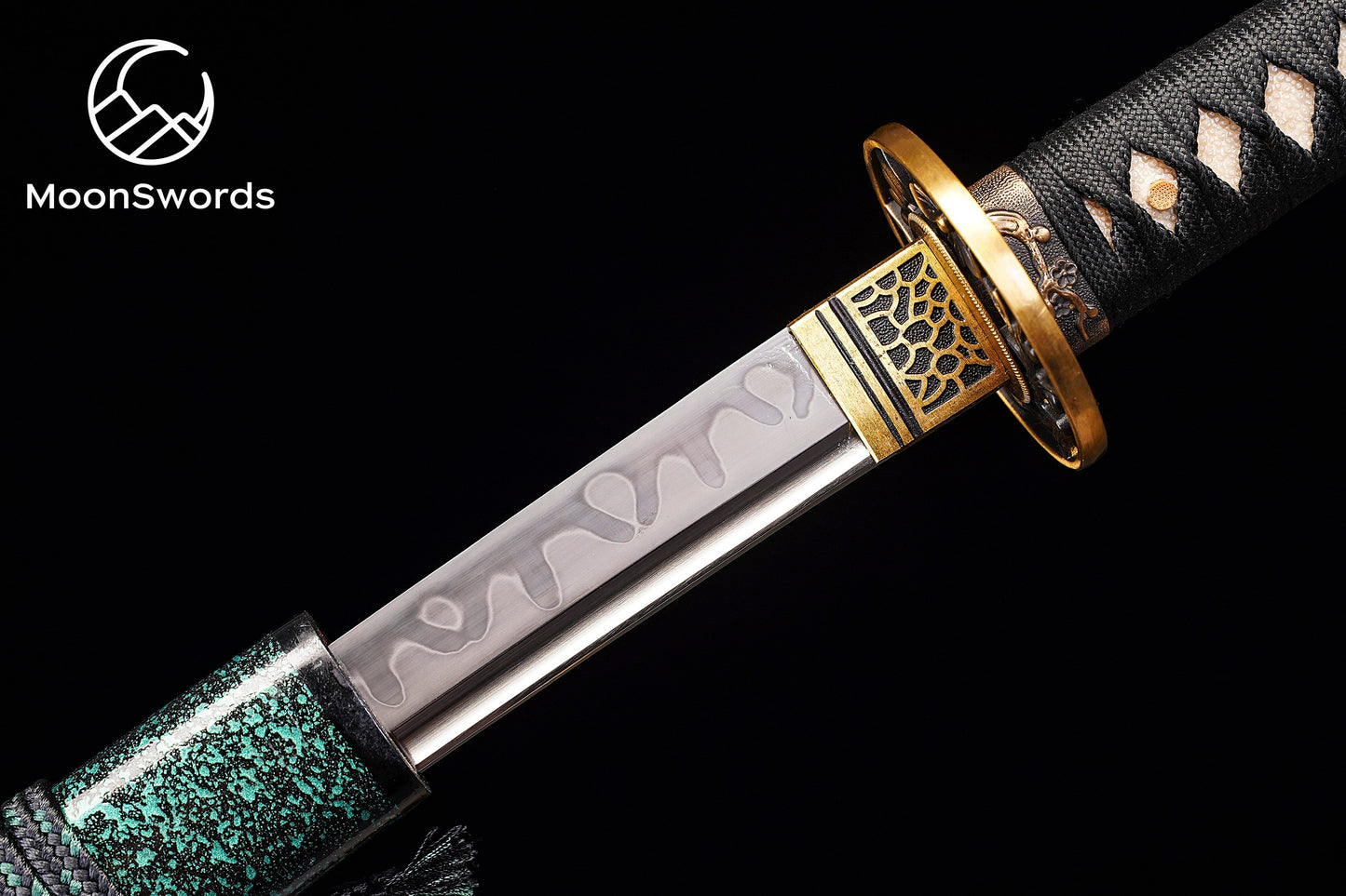 a close up of a knife on a black background