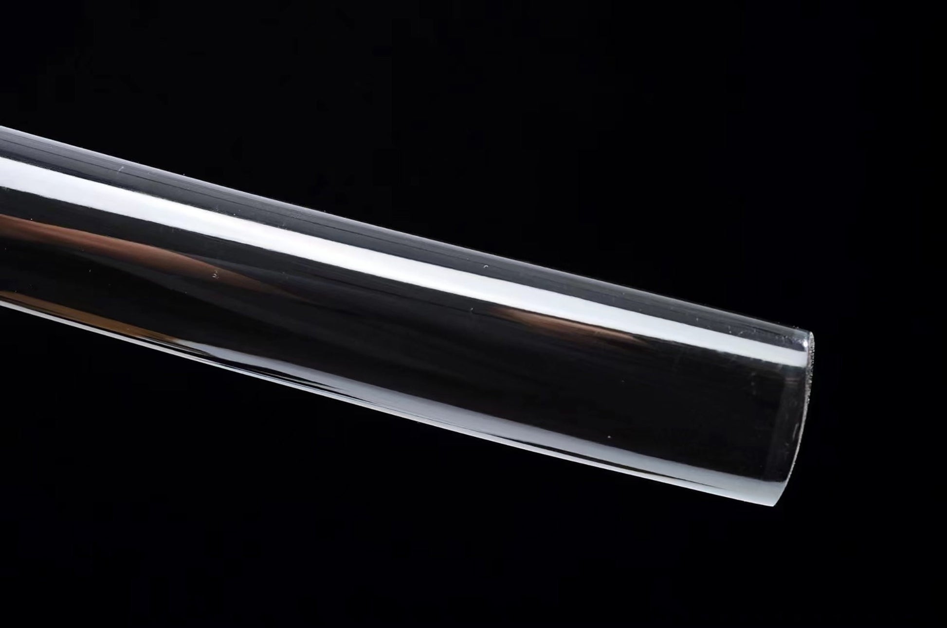 a close up of a glass tube on a black background