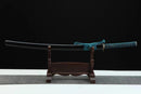 Sword on a wooden stand with a black background