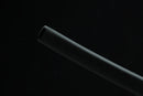 Black cylindrical object on a black background