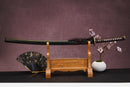 A close-up view of Moonswords Banrin Katana, with a brown handle and white accents, featuring intricate designs and patterns.
