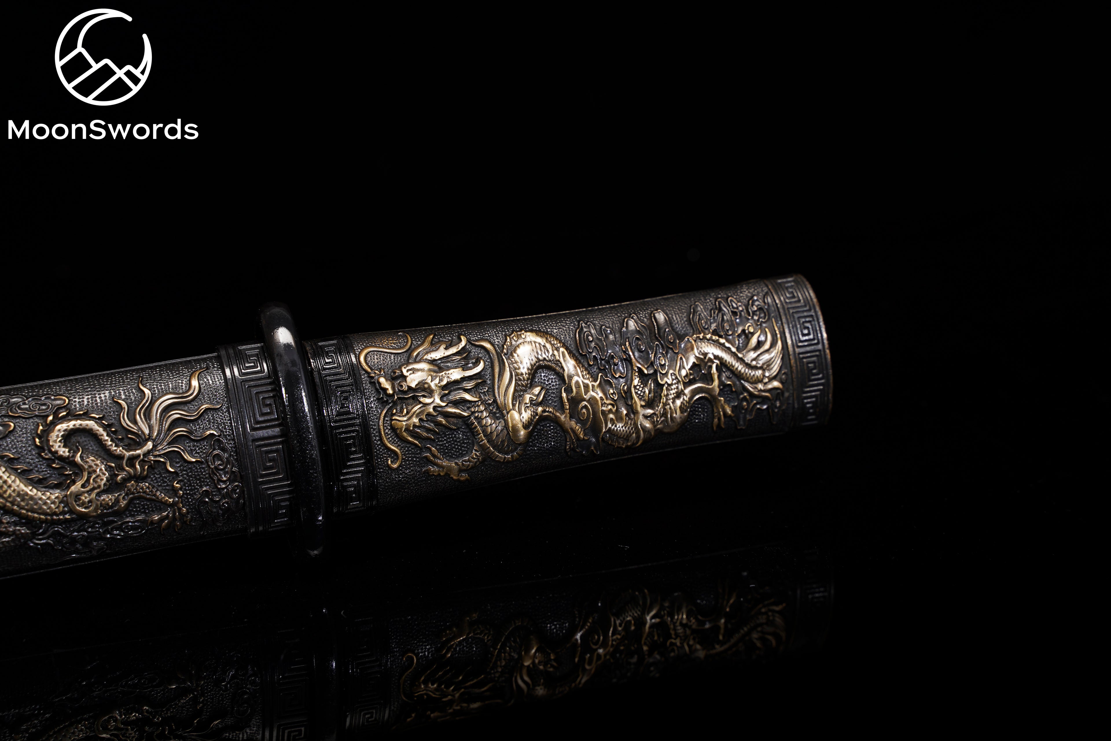 Load video: “Close-up video of a Moonswords Damascus steel katana with Bronzesaya and sculpted copper guard”