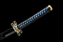 A close-up view of Demon Slayer Nichirin Metal Katana, a black and blue sword with a decorative handle, against a black background.