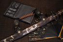 A close-up view of Moonswords Furin Kazan Katana with black shealth.