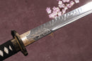 A close-up view of a Clay-Tempered T10 blade with textures against a textured background.