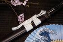A close-up view of Moonswords Ghost of Yotei Katana with black shealth.