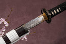 A close-up view of Moonswords Ghost of Yotei Katana with Hamon on the blade