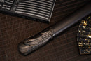 A close-up view of Moonswords Ghost of Yotei Katana with black shealth.