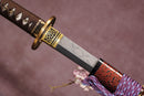 A close-up view of Moonswords Hi No Ko Katana with Hamon on the blade