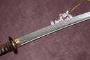A close-up view of a sword with a brown hilt and a Clay-Tempered blade, set against a textured background.