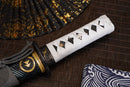 A close-up view of Moonswords Ghost of Tsushima Tanto with black shealth.