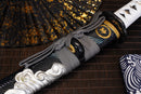 A close-up view of Moonswords Ghost of Tsushima Tanto with black shealth.