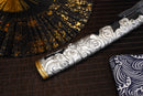 A close-up view of Moonswords Ghost of Tsushima Tanto with black shealth.