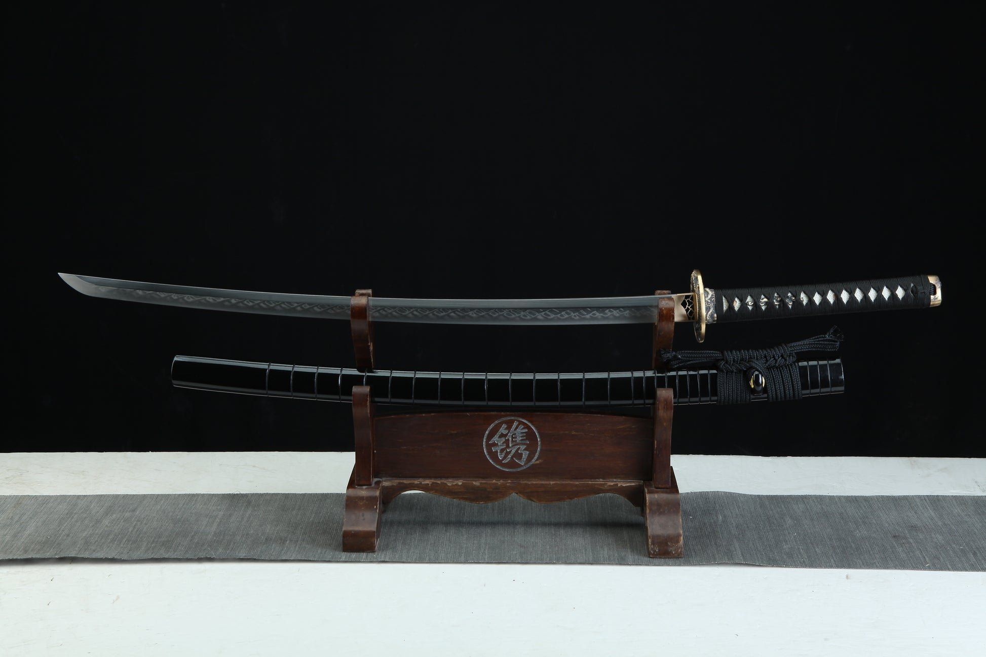 Complete Jaryū 邪龍 Evil Dragon katana 39.3 inches total length showing traditional Japanese sword construction with black lacquered scabbard