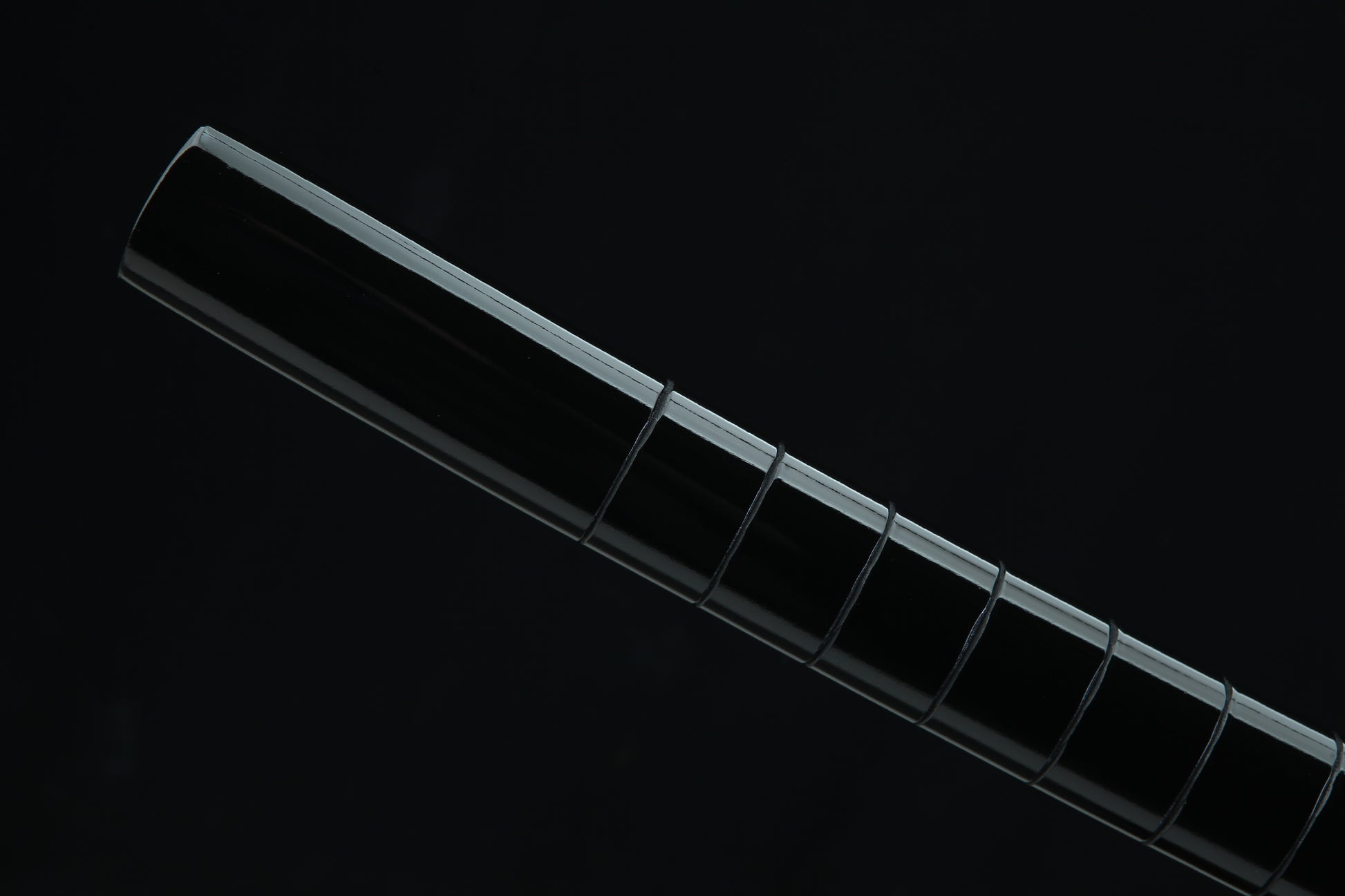Black lacquered wooden saya scabbard of Jaryū Evil Dragon katana with black cord wrapping and traditional Japanese finish