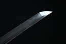 Sōō Blue Cherry Blossom katana blade tip showing clay-tempered Damascus steel with distinctive folded pattern construction