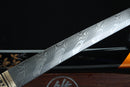 Close-up of a Damascus steel sword blade on a dark background