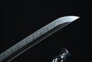 Sword blade with engraved patterns on a black background