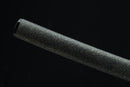 Black textured cylindrical object on a black background
