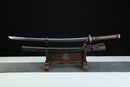 Sword on a wooden stand with a black background