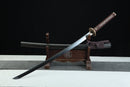 Sword on a wooden stand with a black background