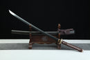Sword on a wooden stand with a black background