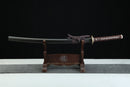 Sword on a wooden stand with a black background