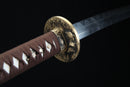 Sword with brown handle and gold guard on a black background