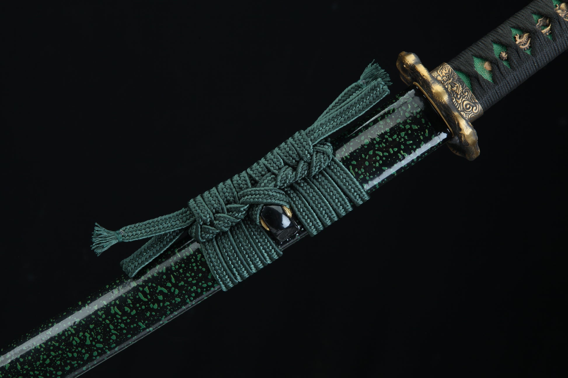 Green braided belt with a decorative buckle on a black background