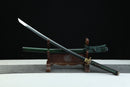 Sword on a wooden stand with a black background