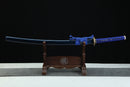 Sword on a wooden stand with a black background