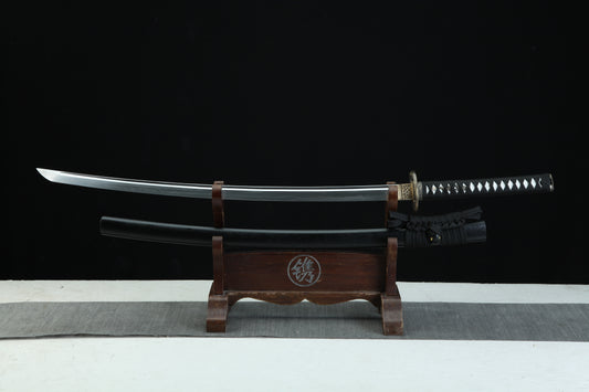 Sword on a wooden stand with a black background