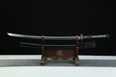 Sword on a wooden stand with a black background