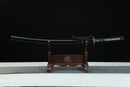 Sword on a wooden stand with a black background