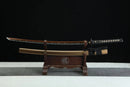 Sword on a wooden stand against a black background