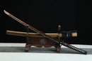 Sword on a wooden stand with a black background