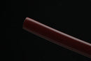 Close-up of a brown Katana on a black background
