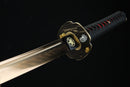 Sword with a decorative hilt on a black background