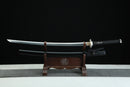 Sword on a wooden stand with a black background